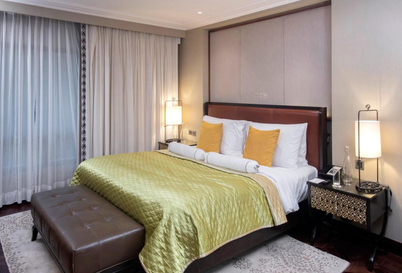 The Claridges New Delhi Hotel Exterior photo A bedroom at the Taj Bengal
